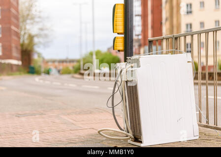 Abandoned Washing Machine or Tumble Dryer on English Street Road. Stock Photo