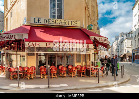 Two men walking past the Café le Descartes Paris, a Parisian brasserie at rue du Cardinal Lemoine in the 5th arrondissement of Paris ,France Stock Photo