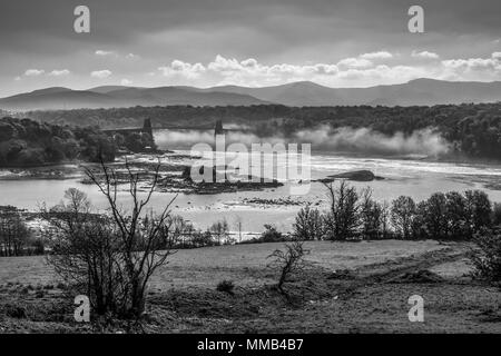 Menai Bridge and mist over the Menai straits between north Wales and Anglesey UK Stock Photo