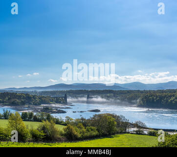 Menai Bridge and mist over the Menai straits between north Wales and Anglesey UK Stock Photo