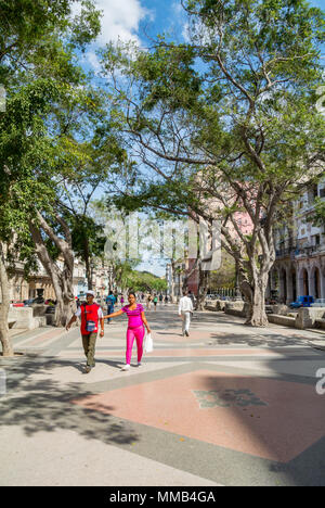 Local people walking along paseo de marti prado, Havana, Cuba, Central America Stock Photo
