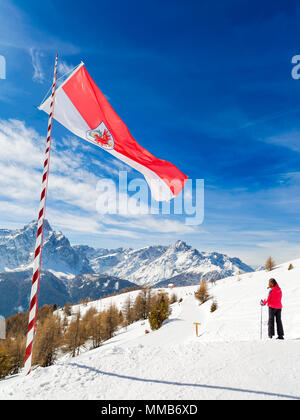 Austrian flag fluttering in front of the Italian Alps, Monte Elmo, Italy Stock Photo