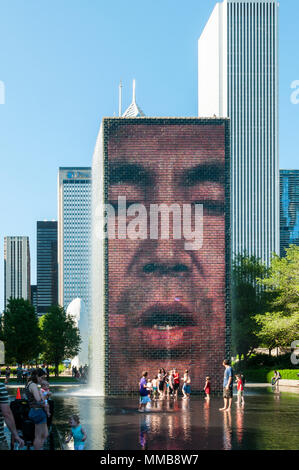 Children playing in Crown Fountain In Millennium Park, Chicago. Stock Photo