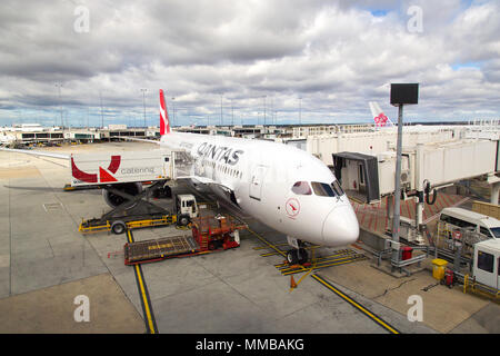 Melbourne, Australia: April 16, 2018: Qantas airplane at Tullamarine Airport being refuelled and restocked for the next flight. Qantas Airways is the Stock Photo