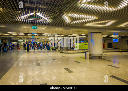 MOSCOW, RUSSIA- APRIL, 24, 2018: Indoor view of passengers walking and waiting for the departure in the huge waiting hall of the international airport of Vnukovo Stock Photo