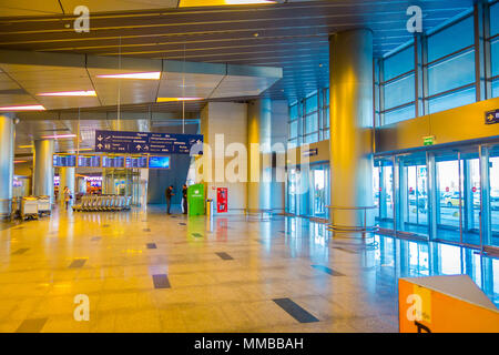 MOSCOW, RUSSIA- APRIL, 24, 2018: Indoor view of passengers walking and waiting for the departure in the huge waiting hall of the international airport of Vnukovo Stock Photo