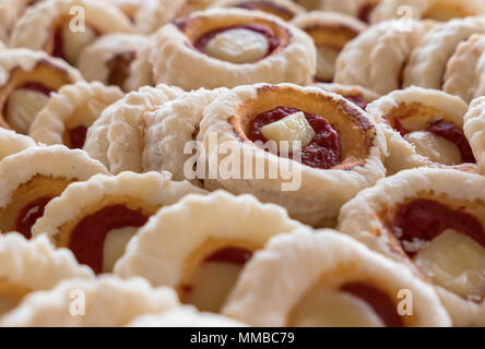 Group of Small pizzas with mozzarella and tomato. Traditional and famous Italian plate. In particular, mini pizzas, are used as aperitifs in parties a Stock Photo