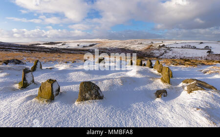 A snowy panoramic image of Nine Maidens Stone Circle on Dartmoor with High Wilhays in the background Stock Photo