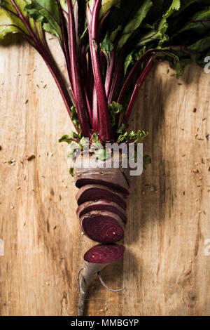 high angle view of a chopped raw beetroot on a wooden table Stock Photo