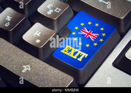 Exit push button on a black keyboard with the british flag in the middle of the european flag stars. Brexit concept. Stock Photo