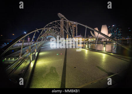 The Helix bridge with Marina Bay Sands in background, Singapore Stock Photo