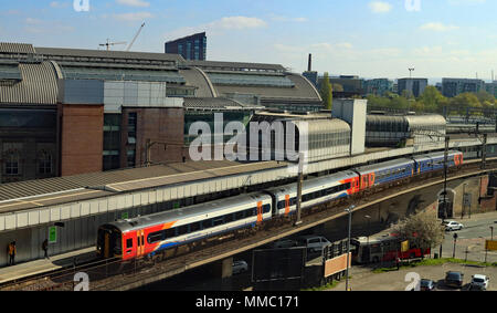 On the early May Bank holiday Saturday an East Midlands train arrives at Manchester Piccadilly with a service from Nottingham to Liverpool Lime Street Stock Photo