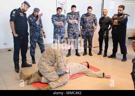 (170916-M-ZZ999-006) U.S 5TH FLEET AREA OF OPERATIONS (Sept. 16, 2017) – Members of the Kuwaiti Ministry of Interior Explosive Ordnance Team provide first responder care and a primary exam to a simulated casualty during the final trauma exercise during a medical exchange with the Kuwaiti Ministry of Interior explosive ordnance team in Kuwait. The 15th MEU is deployed with the America Amphibious Ready Group in order to maintain regional security in the U.S. 5th Fleet area of operations. (Courtesy photo by Hospital Corpsman 1st Class Tonya Jury) Stock Photo