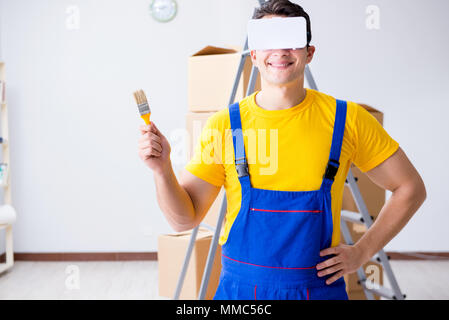 Painter contractor working with virtual reality goggles Stock Photo