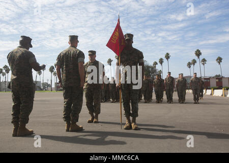 Master Sgt. Carlos Gonzales, 41, center, salutes Col. Chandler Nelms ...