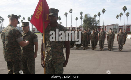 Master Sgt. Carlos Gonzales, 41, center, salutes Col. Chandler Nelms ...