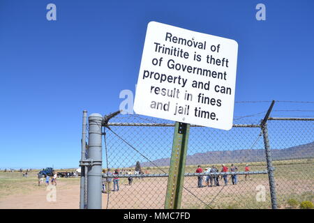 Trinitite is the glassy residue formed by the July 16, 1945, Trinity nuclear explosion at White Sands Missile Range in New Mexico. The archival image documents a posted sign instructing visitors not to remove trinitite during an open house at Trinity Site on October 7, 2017. Stock Photo