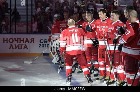 Sochi, Russia. 10th May, 2018. Russian President Vladimir Putin, #11, congratulates players during the Night Hockey League match during the 7th Russian Amateur Ice Hockey Festival at the Bolshoy Ice Dome May 10, 2018 in Sochi, Russia.  (Russian Presidency via Planetpix) Credit: Planetpix/Alamy Live News Stock Photo