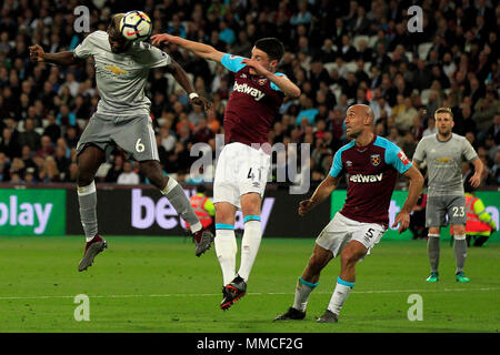 London, UK. 10th May 2018. Paul Pogba of Manchester United (L) heads a chance at goal. Premier League match, West Ham United v Manchester United at the London Stadium, Queen Elizabeth Olympic Park in London on  Thursday 10th May 2018.  this image may only be used for Editorial purposes. Editorial use only, license required for commercial use. No use in betting, games or a single club/league/player publications . pic by Steffan Bowen/Andrew Orchard sports photography/Alamy Live news Stock Photo