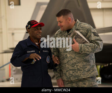 Army Air Corps Staff Sgt. Leslie Edwards, a Tuskegee Airman of the 617th Bombardment Squadron, meets Tech. Sgt. Jeremiah Frye, 477th Fighter Group quality assurance inspector, at Joint Base Elmendorf-Richardson, Alaska, Oct. 14, 2017.  The 617th Bombardment Squadron was one of the four Tuskegee Airmen bomber squadrons during World War II that made up the 477th Bombardment Group. In 2007, the 477th Bombardment Group became the 477th Fighter Group, bringing with it the legacy of Tuskegee Airmen to Alaska. (U.S. Air Force photo by Senior Airman Curt Beach) Stock Photo