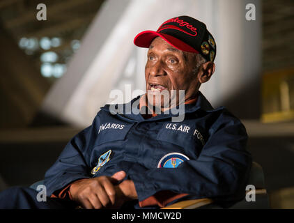 Army Air Corps Staff Sgt. Leslie Edwards, a Tuskegee Airman of the 617th Bombardment Squadron, speaks with historians at Joint Base Elmendorf-Richardson, Alaska, Oct. 14, 2017. The 617th Bombardment Squadron was one of the four Tuskegee Airmen bomber squadrons during WWII that made up the 477th Bombardment Group. In 2007, the 477th Bombardment Group became the 477th Fighter Group, bringing with it the legacy of Tuskegee Airmen to Alaska. (U.S. Air Force photo by Senior Airman Curt Beach) Stock Photo