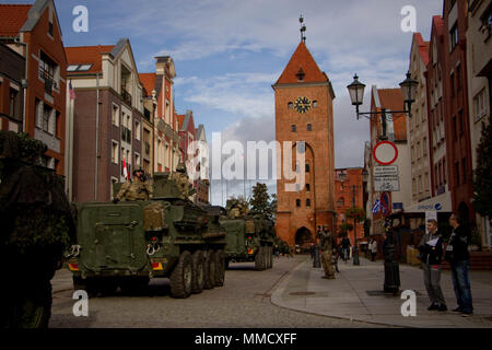 Soldiers from 3rd Squadron, 2d Cavalry Regiment, U.S. Army, spend the day in Elblag, Poland greeting local citizens and welcoming them to tour their Stryker Combat Vehicles Oct. 15, 2017. The Squadron is heading to Poland to be part of Battle Group Poland in support of NATO’s enhanced Forward Presence initiative. Stock Photo
