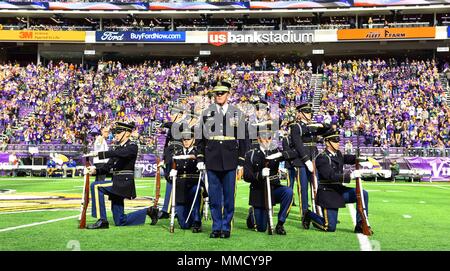 Seattle Seahawks vs. Minnesota Vikings. Fans support on NFL Game.  Silhouette of supporters, big screen with two rivals in background. Stock  Photo