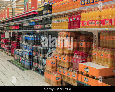 Rimini, Italy, March 21, 2018 shelves of soda bottles to shopping center , symbols of trash food and increase of fat people Stock Photo