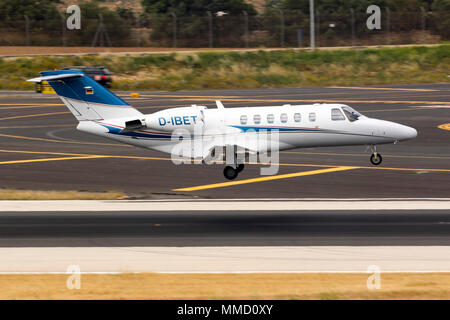A private Cessna 525 Citation CJ2 [REG; D-IBET] performing a midfield landing runway 31. Stock Photo
