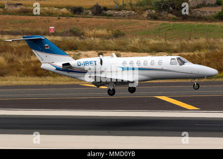 A private Cessna 525 Citation CJ2 [REG; D-IBET] performing a midfield landing runway 31. Stock Photo