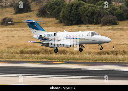 A private Cessna 525 Citation CJ2 [REG; D-IBET] performing a midfield landing runway 31. Stock Photo