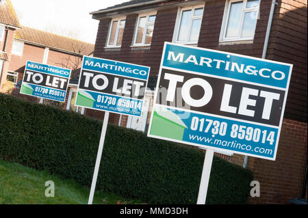 To Let signs in suburban street Stock Photo