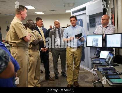 Naval Air Warfare Center Training Systems Division is a United States Navy command based in Orlando, Florida, responsible for developing training systems and simulation technologies. On October 18, 2017, a computer engineer demonstrated eHelm and Virtual Interactive Shipboard Instructional Tour 3D during a Ready, Relevant Learning Summit. The archival image documents technology integration for fleet training modernization. Stock Photo