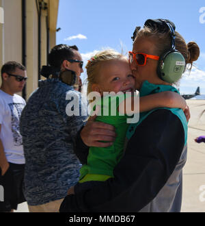 A U.S. Air Force spouse embraces her daughter after an HH-60G Pavehawk orientation flight during the 563rd Rescue Group’s annual Spouse Appreciation Day at Davis-Monthan Air Force Base, Ariz., March 17, 2018. This year’s celebration provided HH-60 and HC-130J Combat King II orientation flights to 563rd RQG spouses. (U.S. Air Force Stock Photo