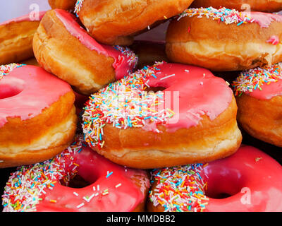 Pink iced ring doughnuts Stock Photo