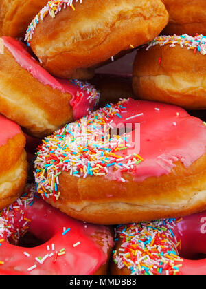 Pink iced ring doughnuts Stock Photo