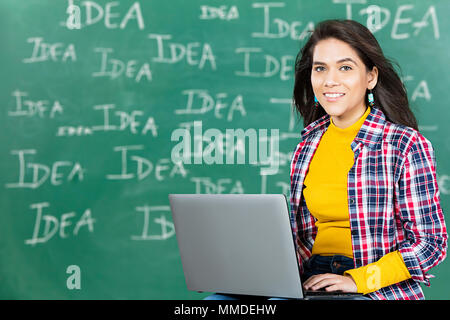 One Teenager Girl College Student Using Laptop And Showing Thumbs-up Stock Photo
