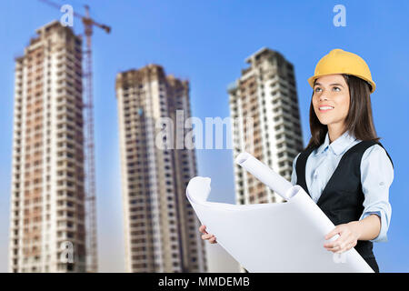 One Female Architect , Engineer Reading Map Real-estate Project Construction Site Stock Photo