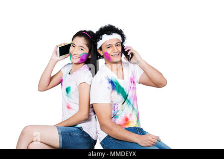 Smiling Two Young Friend Holi Festival Celebration Talking Mobile phone Stock Photo
