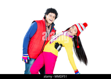 Two Teenager Couple In-Winter Clothes Dance Together Having Fun Enjoying Stock Photo