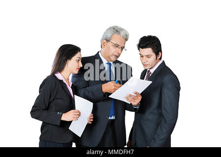 Three business People colleagues Employee Discuss Meeting Document s Paper working Stock Photo