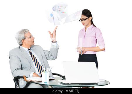 Angry Boss firing employee, flying Papers scared secretary In Office Stock Photo