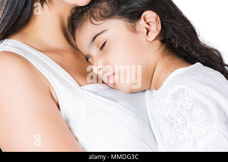 Close-Up Indian Mother with Kid Girl sleeping on her chest Stock Photo