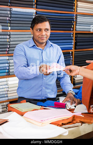 One Salesman Receiving Money Customer Shopping Retail Bill Payment Clothes-Store Stock Photo