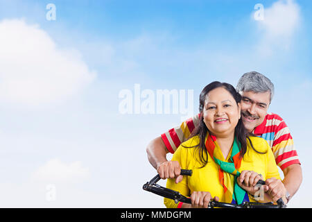 Smiling Senior Couple Ride Bicycle Together Fun Cheerful Outdoors Stock Photo