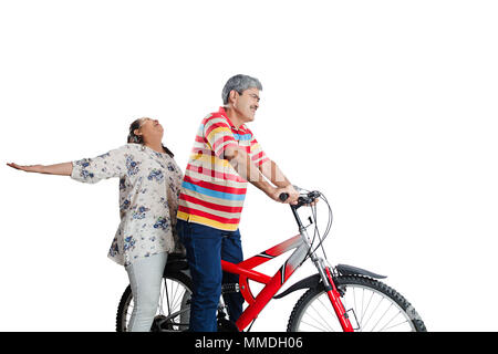 Happy Elderly Couple Together Riding Cycle Fun Cheerful Enjoy Stock Photo