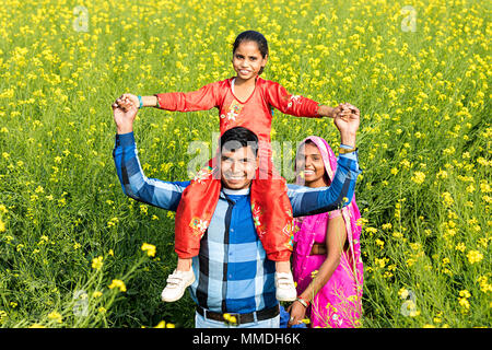 Happy Rural Villager Mother father Carrying Daughter shoulder Farm Enjoying Stock Photo