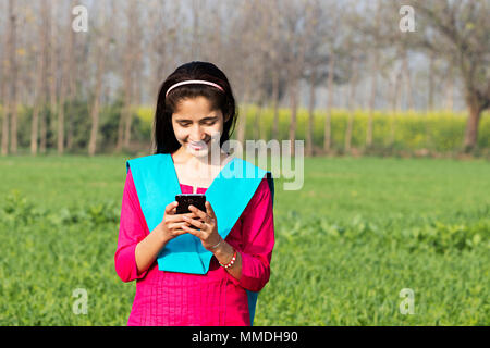 One Rural Villager Young Girl Reading Text-Messaging Mobile-Phone Farm Stock Photo