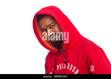 Young man wearing red hoodie facing camera. Side pose Stock Photo