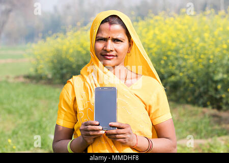 One Indian Rural Farmer Female Holding Mobile-Phone Technology Farm Village Stock Photo
